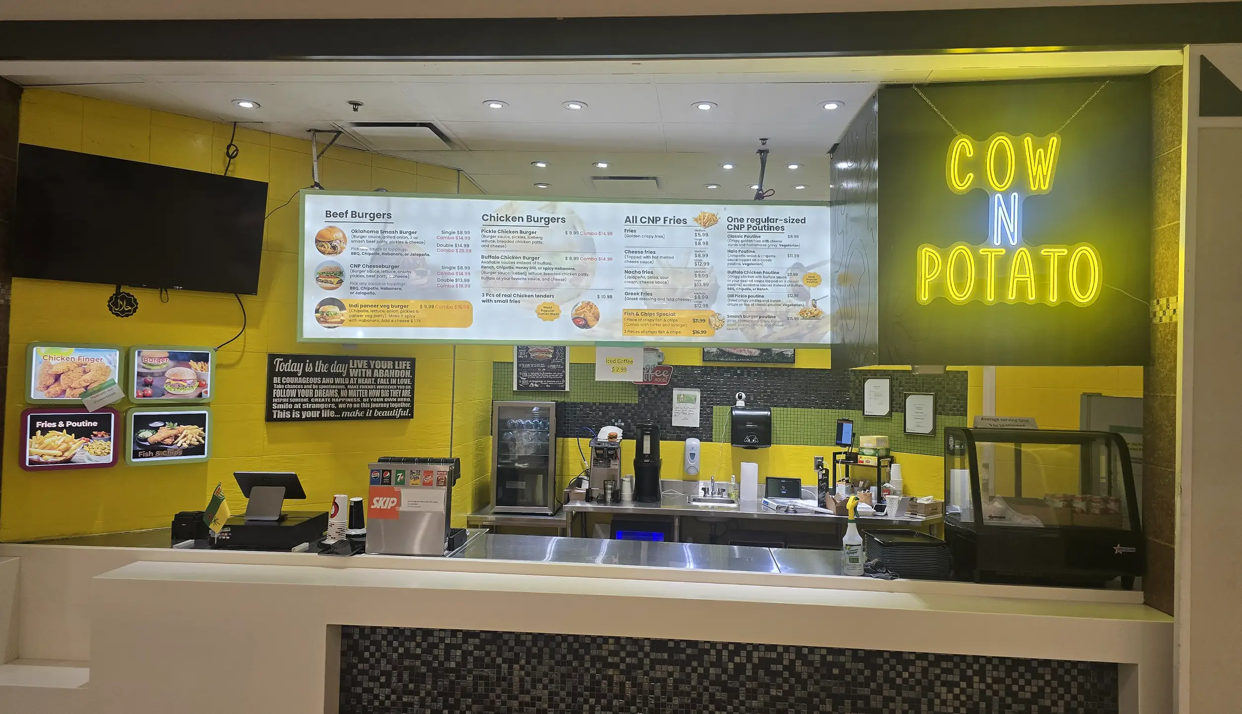Cow N Potato Food Bar counter with lit menu boards in Northgate Mall